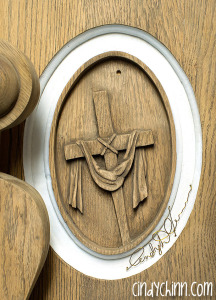 hand carved cross with robe for church pew