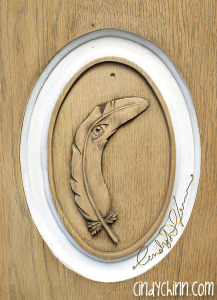 hand carved feather for church pew
