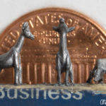 Pencil Carving of a Giraffe Family with Penny