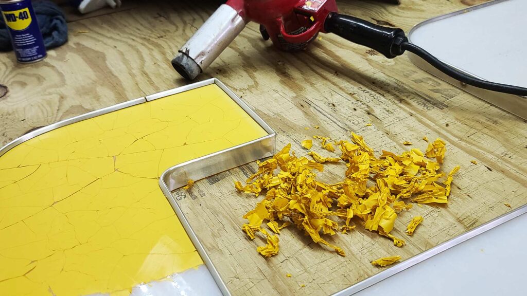 peeling vinyl from old letters